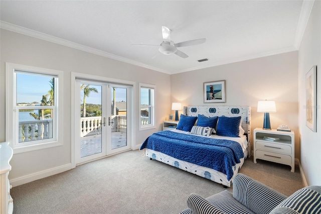 carpeted bedroom with ceiling fan, access to outside, french doors, ornamental molding, and a water view