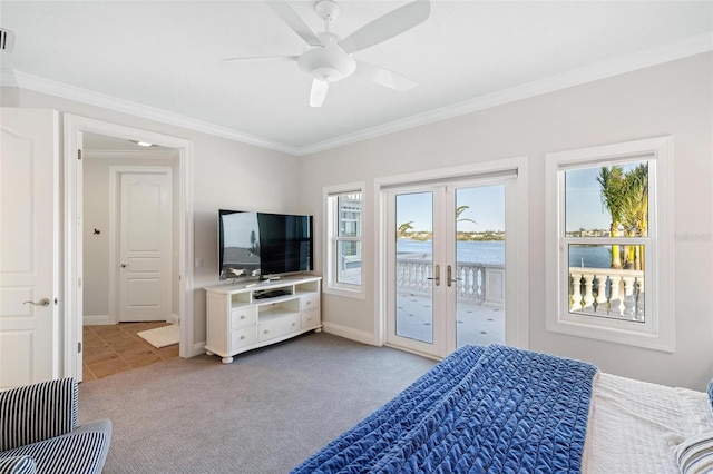 bedroom featuring ceiling fan, access to outside, ornamental molding, light carpet, and french doors