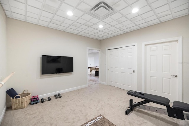 workout room featuring carpet flooring