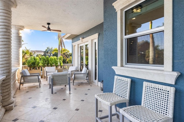 view of patio / terrace with ceiling fan and outdoor lounge area