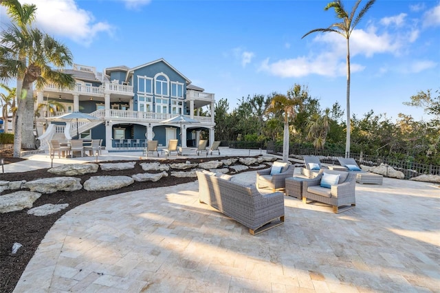 view of patio / terrace featuring an outdoor living space and a balcony