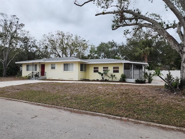 ranch-style home with a front yard