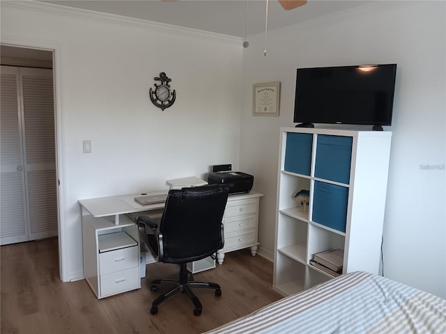 bedroom featuring ornamental molding and wood-type flooring