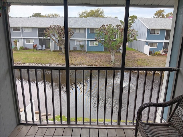 balcony featuring a water view