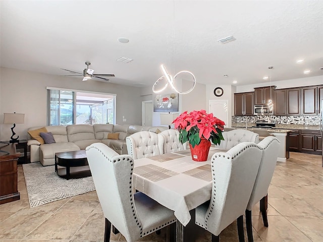 dining space with ceiling fan