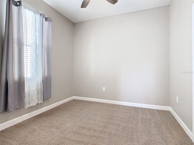 spare room with carpet flooring and ceiling fan