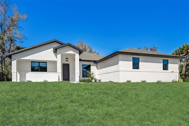 view of front of home with a front lawn