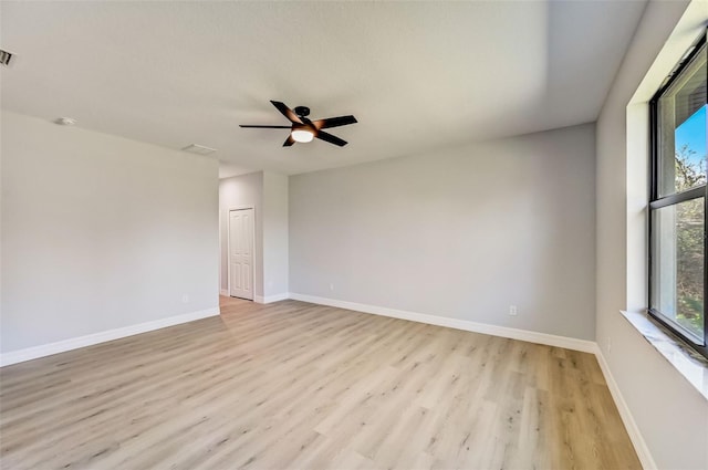 unfurnished room featuring ceiling fan and light wood-type flooring