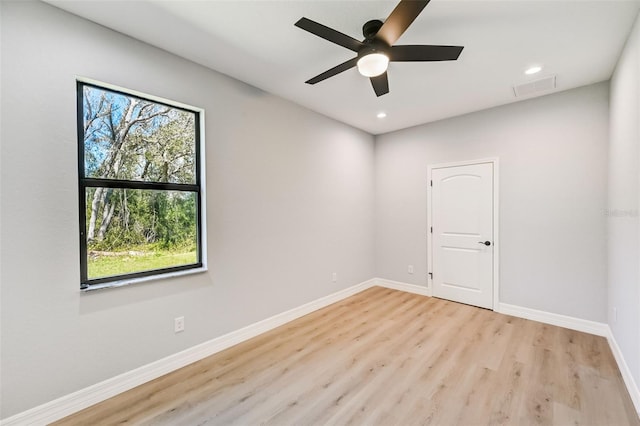 unfurnished room with ceiling fan and light wood-type flooring