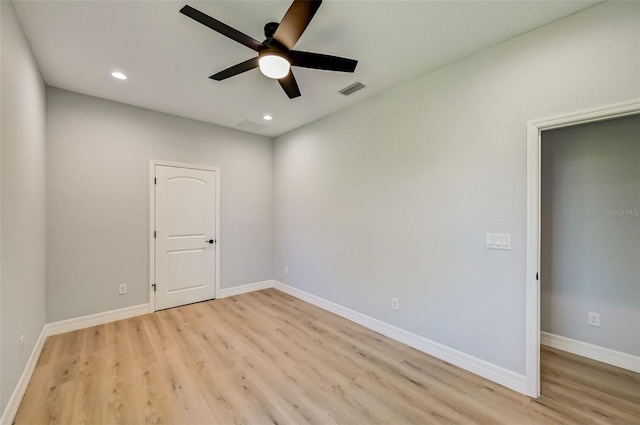 unfurnished room featuring ceiling fan and light hardwood / wood-style flooring