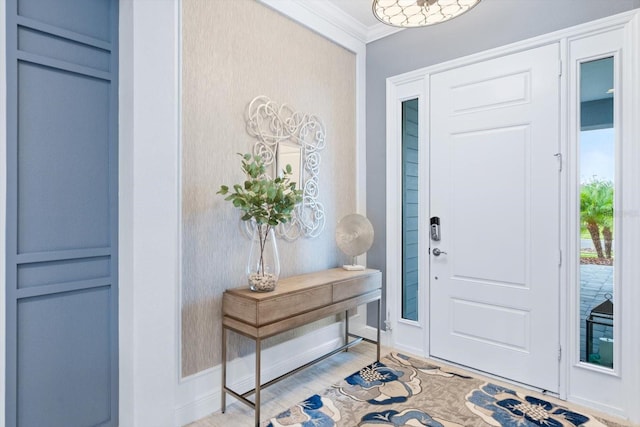 foyer featuring crown molding