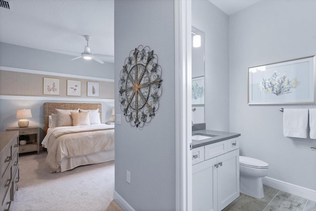 bedroom featuring light carpet and ceiling fan