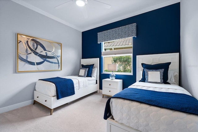 carpeted bedroom with ceiling fan and crown molding