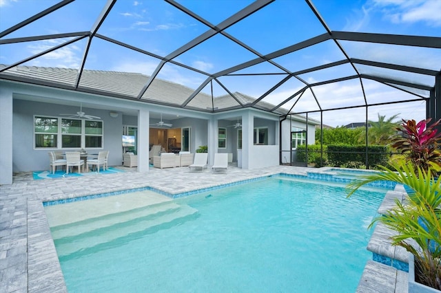 view of swimming pool with a lanai, a patio area, outdoor lounge area, and ceiling fan