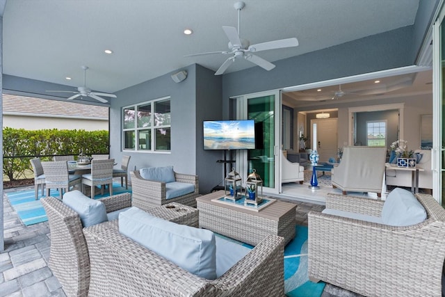 view of patio / terrace featuring ceiling fan and an outdoor living space