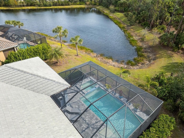 view of pool featuring a lanai and a water view