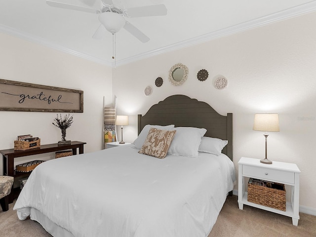 carpeted bedroom featuring crown molding and ceiling fan