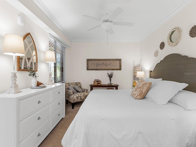 bedroom with crown molding, dark colored carpet, and ceiling fan