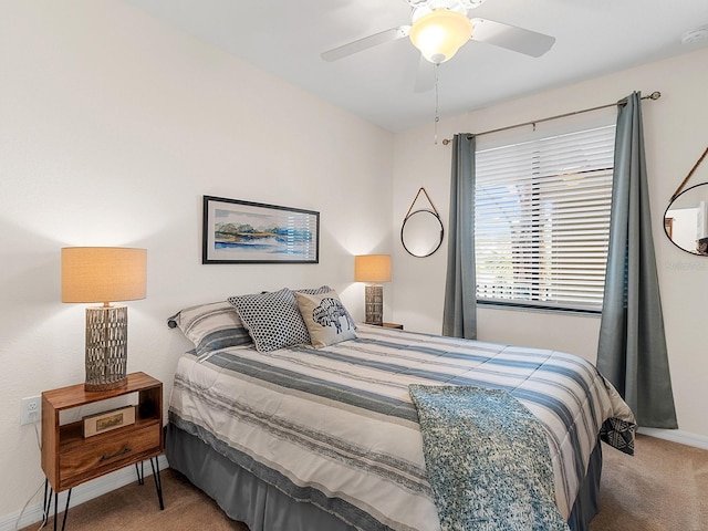 bedroom with ceiling fan and carpet flooring