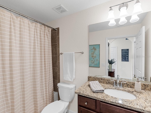 full bathroom with shower / bath combo with shower curtain, a textured ceiling, toilet, and vanity