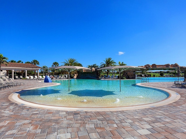 view of pool featuring a patio and pool water feature