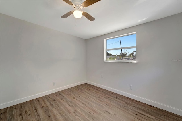 empty room with ceiling fan and light wood-type flooring