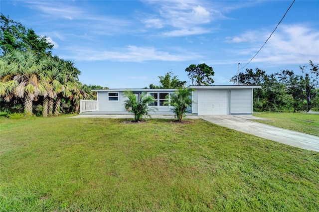 view of front facade with a garage and a front lawn