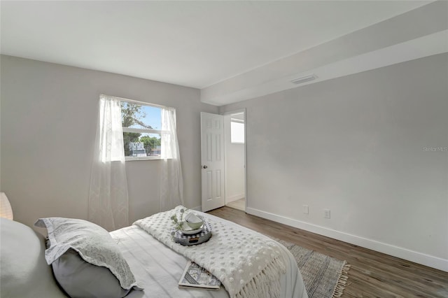 bedroom featuring dark hardwood / wood-style floors