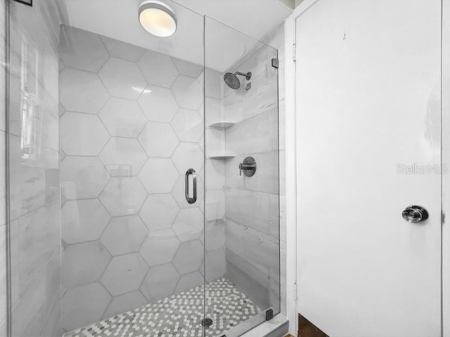 bathroom featuring an enclosed shower