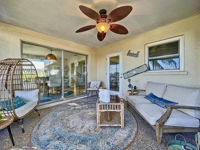 view of patio / terrace with ceiling fan and outdoor lounge area