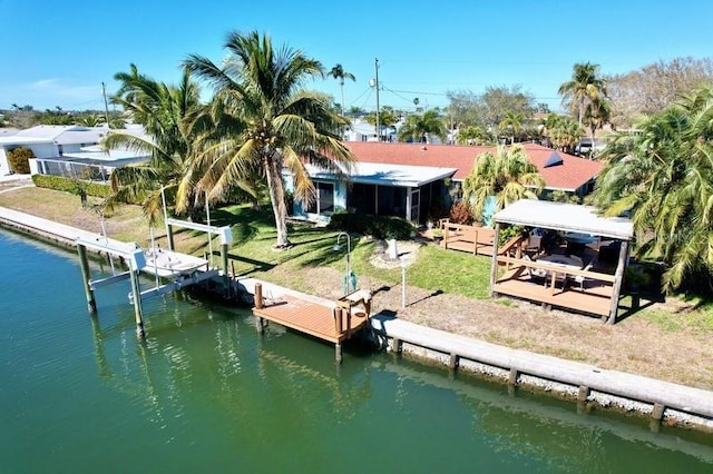 rear view of house featuring a water view