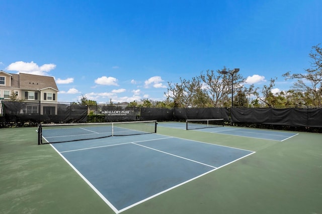 view of sport court with basketball hoop