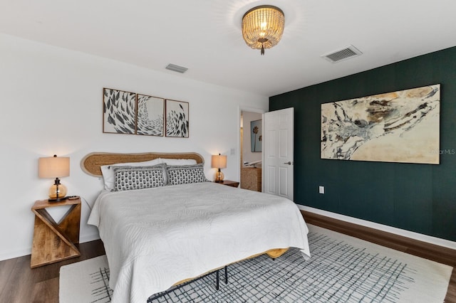 bedroom featuring dark hardwood / wood-style floors