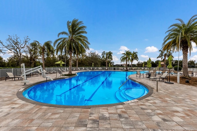 view of swimming pool with a patio