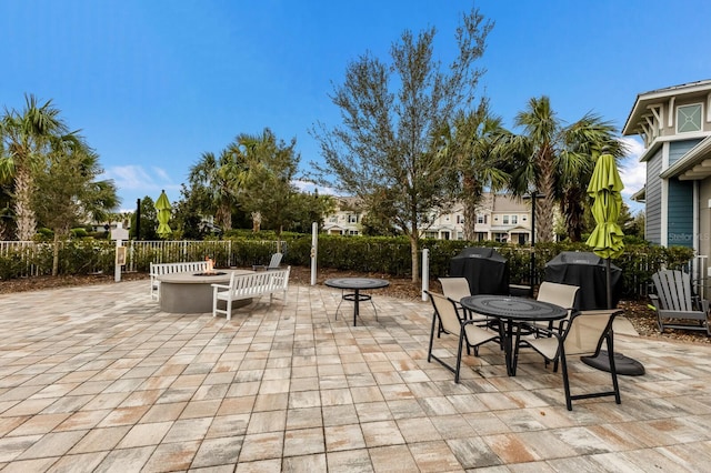 view of patio / terrace with an outdoor fire pit