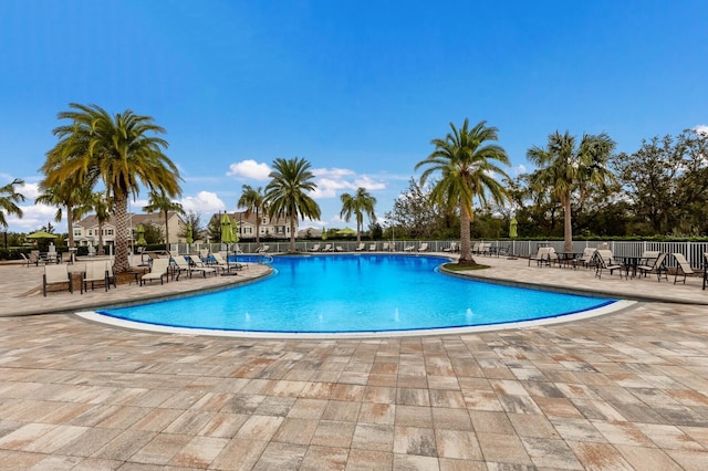 view of swimming pool with a patio