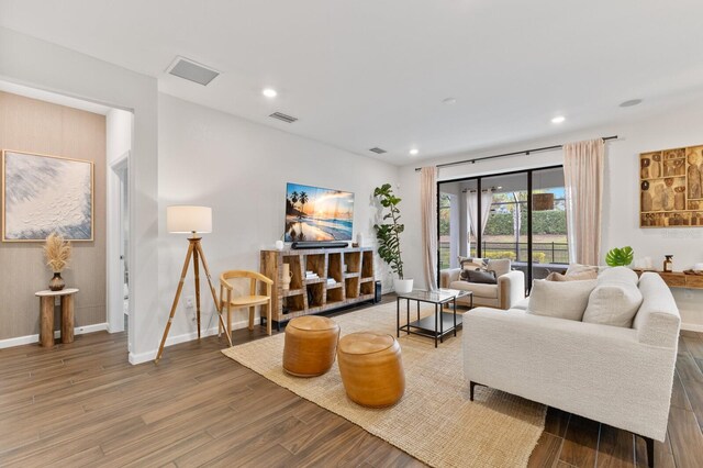 3409 Anchor Bay Trl, Lakewood Ranch, FL 34211 - living room featuring wood finished floors, baseboards, and recessed lighting