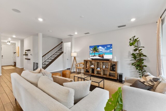 3409 Anchor Bay Trl, Lakewood Ranch, FL 34211 - living room featuring stairs, recessed lighting, wood finished floors, and baseboards