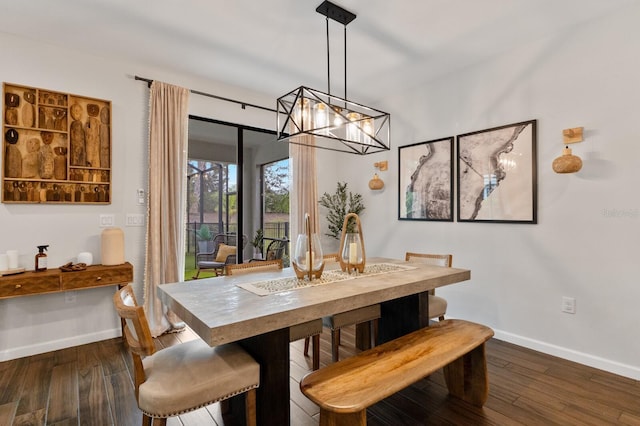 3409 Anchor Bay Trl, Lakewood Ranch, FL 34211 - dining room featuring baseboards, dark wood-style floors, and a chandelier