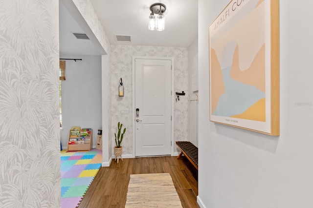 3409 Anchor Bay Trl, Lakewood Ranch, FL 34211 - entryway featuring wallpapered walls, wood finished floors, and baseboards