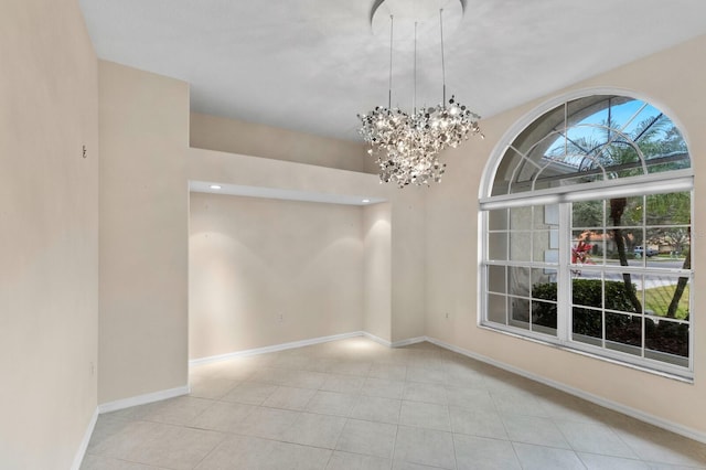 unfurnished dining area with light tile patterned floors and an inviting chandelier