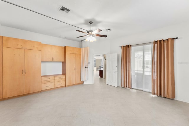 unfurnished bedroom featuring ceiling fan