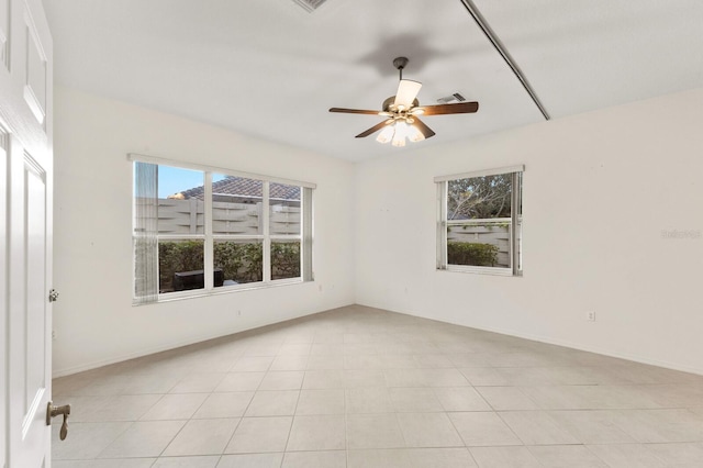 spare room with ceiling fan