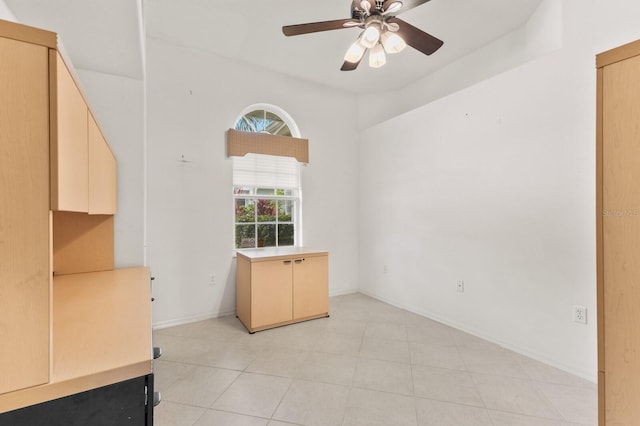 unfurnished room featuring ceiling fan