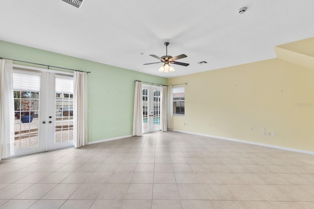 spare room with ceiling fan, light tile patterned flooring, and french doors