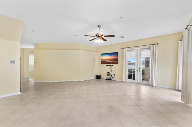 spare room with ceiling fan, light tile patterned floors, and french doors