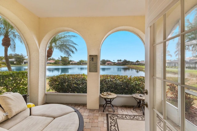 sunroom with a water view