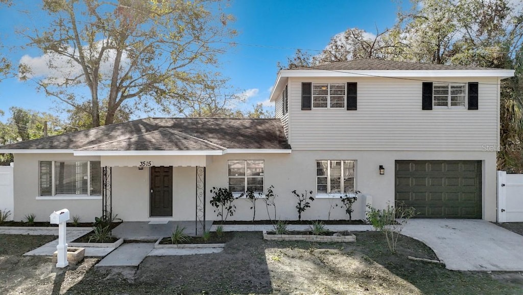 view of front of house with a porch and a garage