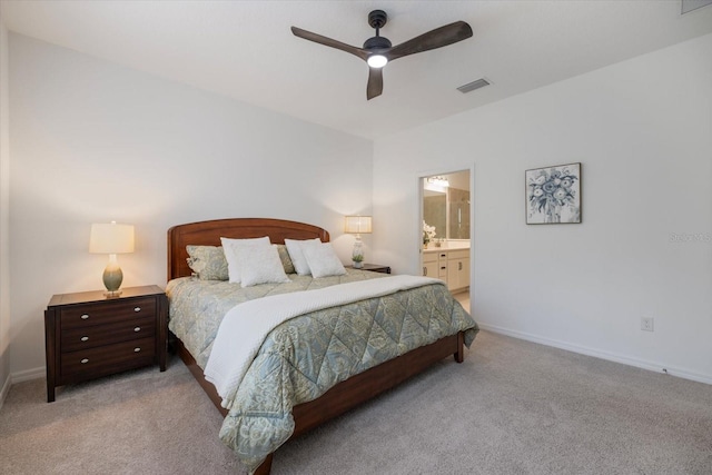 carpeted bedroom featuring ceiling fan and ensuite bathroom