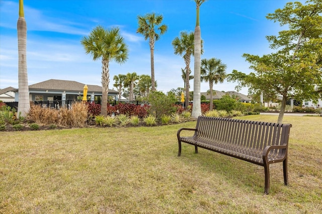 view of property's community featuring a yard